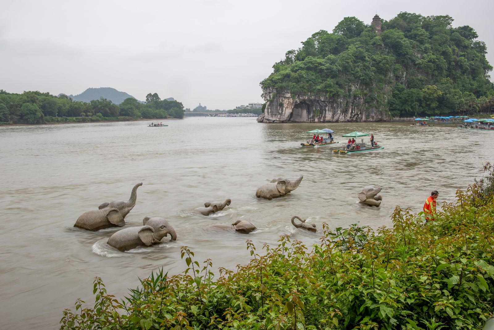 Stone elephant statues by the river near Elephant Trunk Hill
