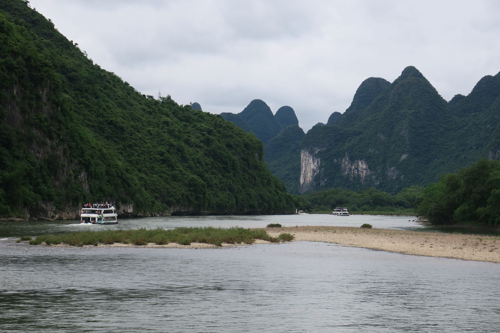 A cruise boat on the Li River among karst peaks