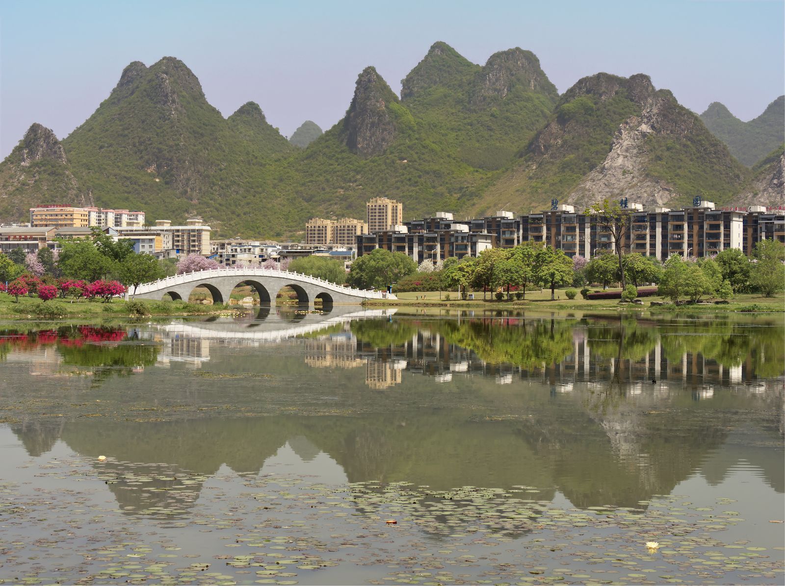 A lake with karst mountains in a Guilin park