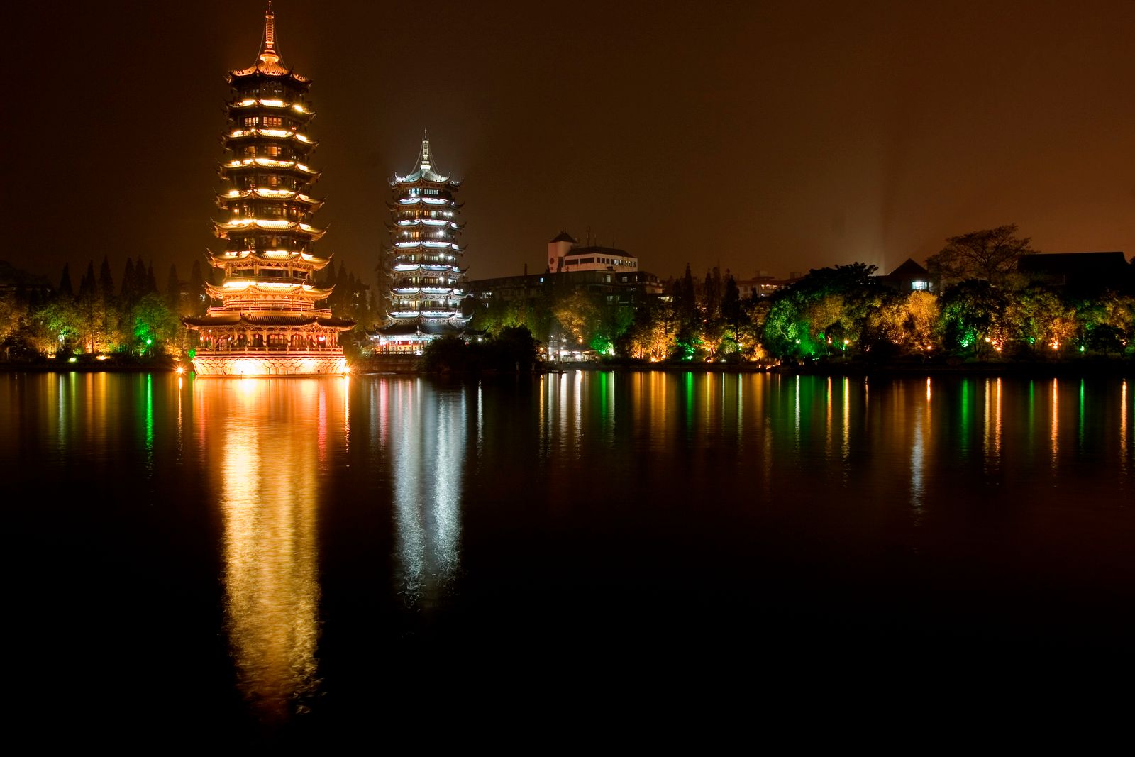 Lit pagodas reflected at night in Guilin