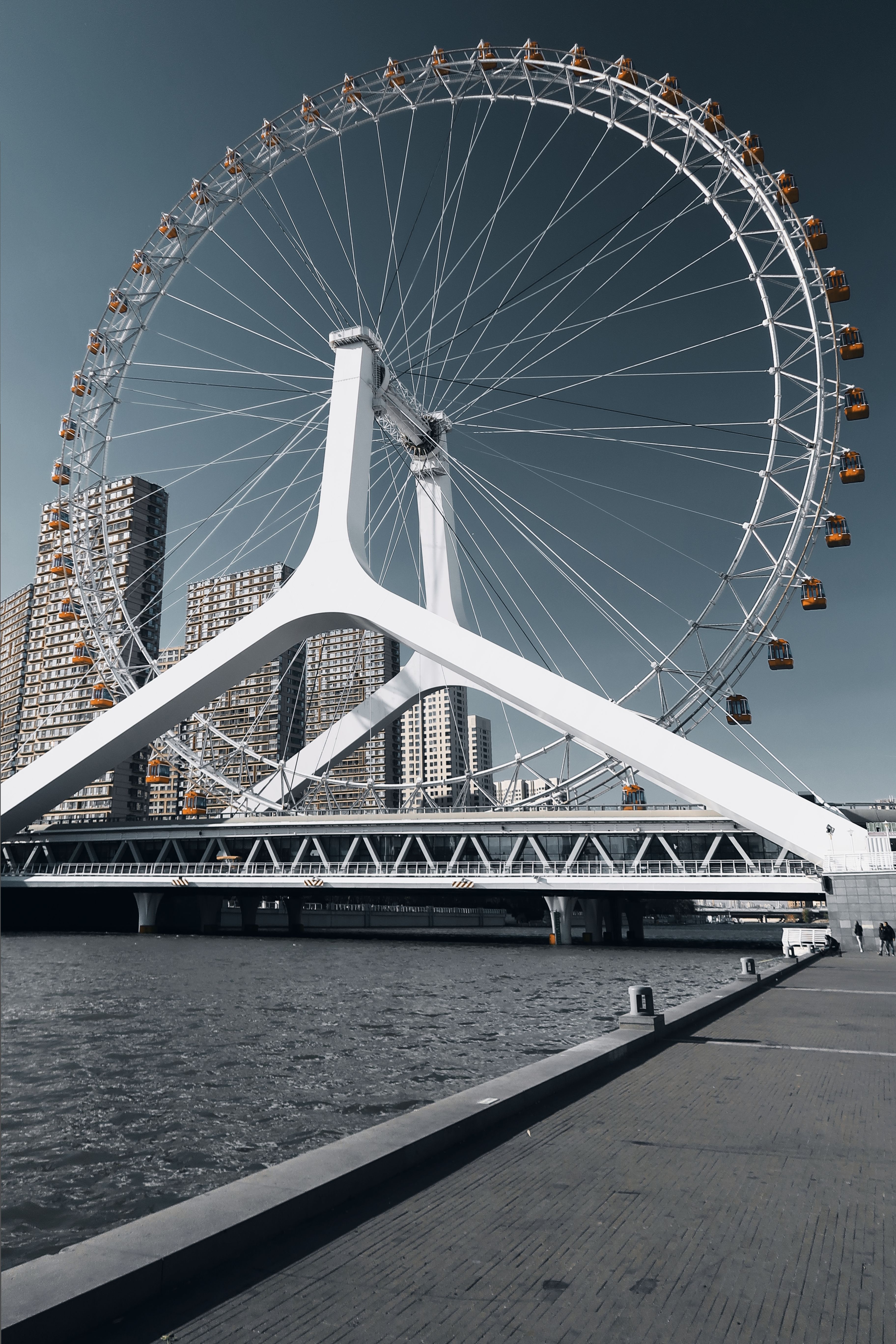 The Tianjin Eye ferris wheel lit on the Yongle Bridge over the Haihe River