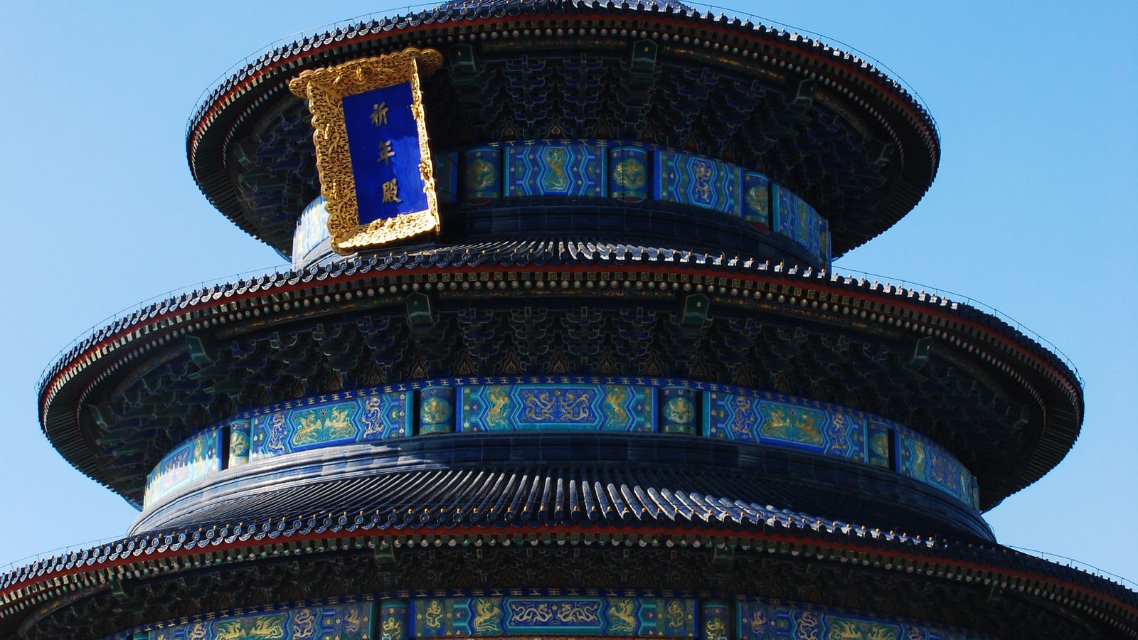 The Hall of Prayer for Good Harvests at the Temple of Heaven in Beijing — three concentric blue-tiled roofs under a clear sky
