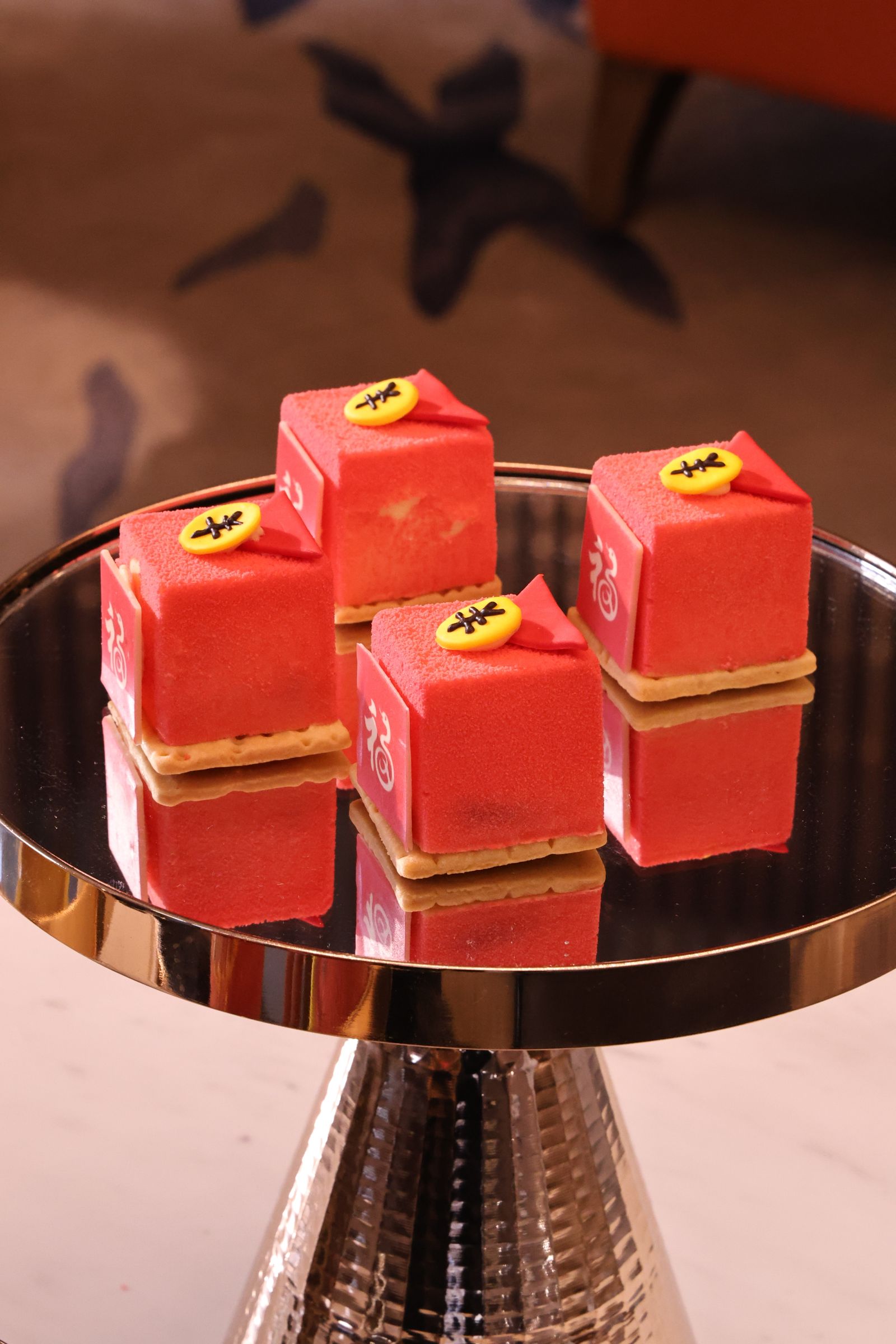 Red decorative pastries on a stand