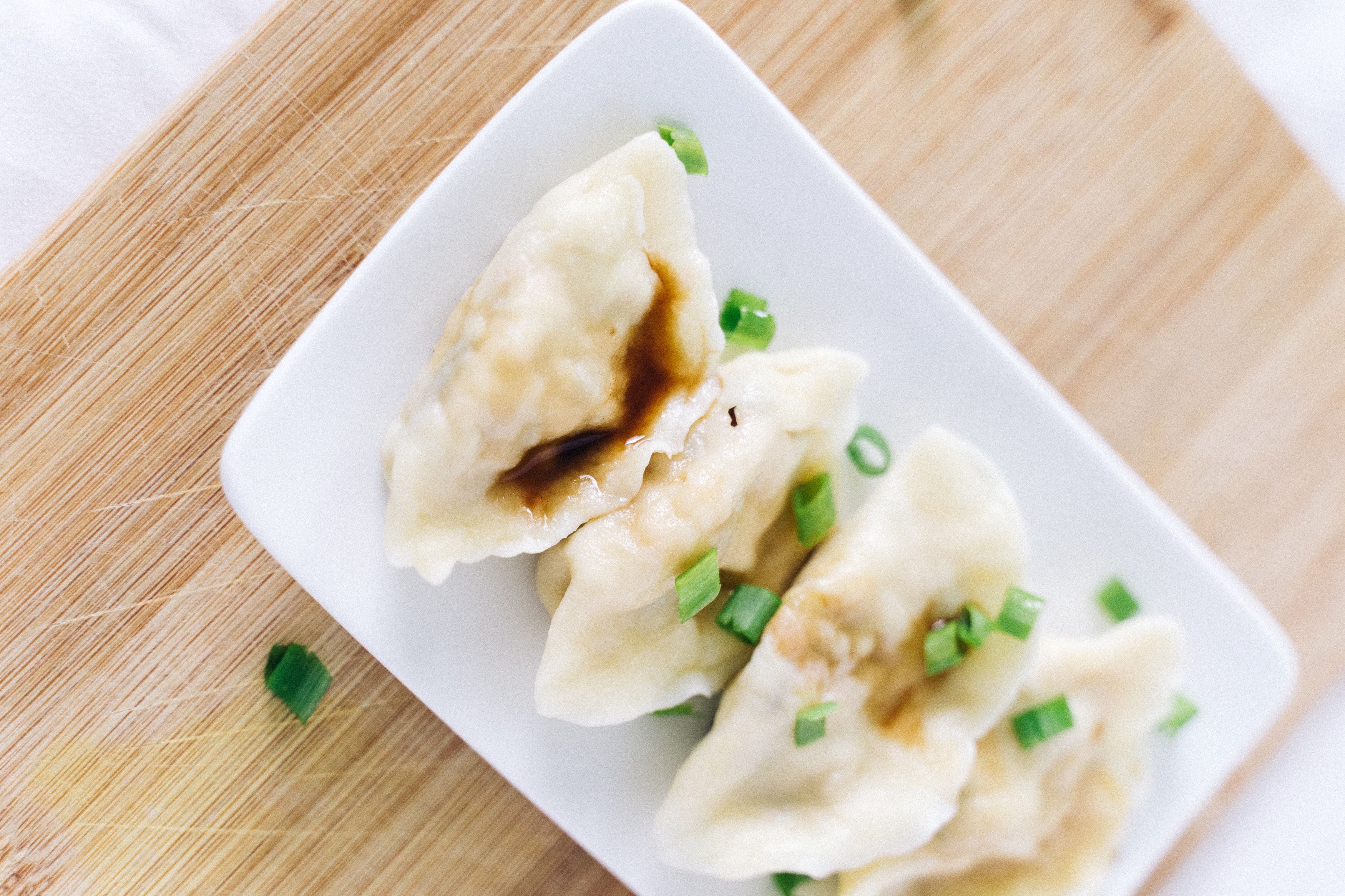 Steamed dumplings on a ceramic plate
