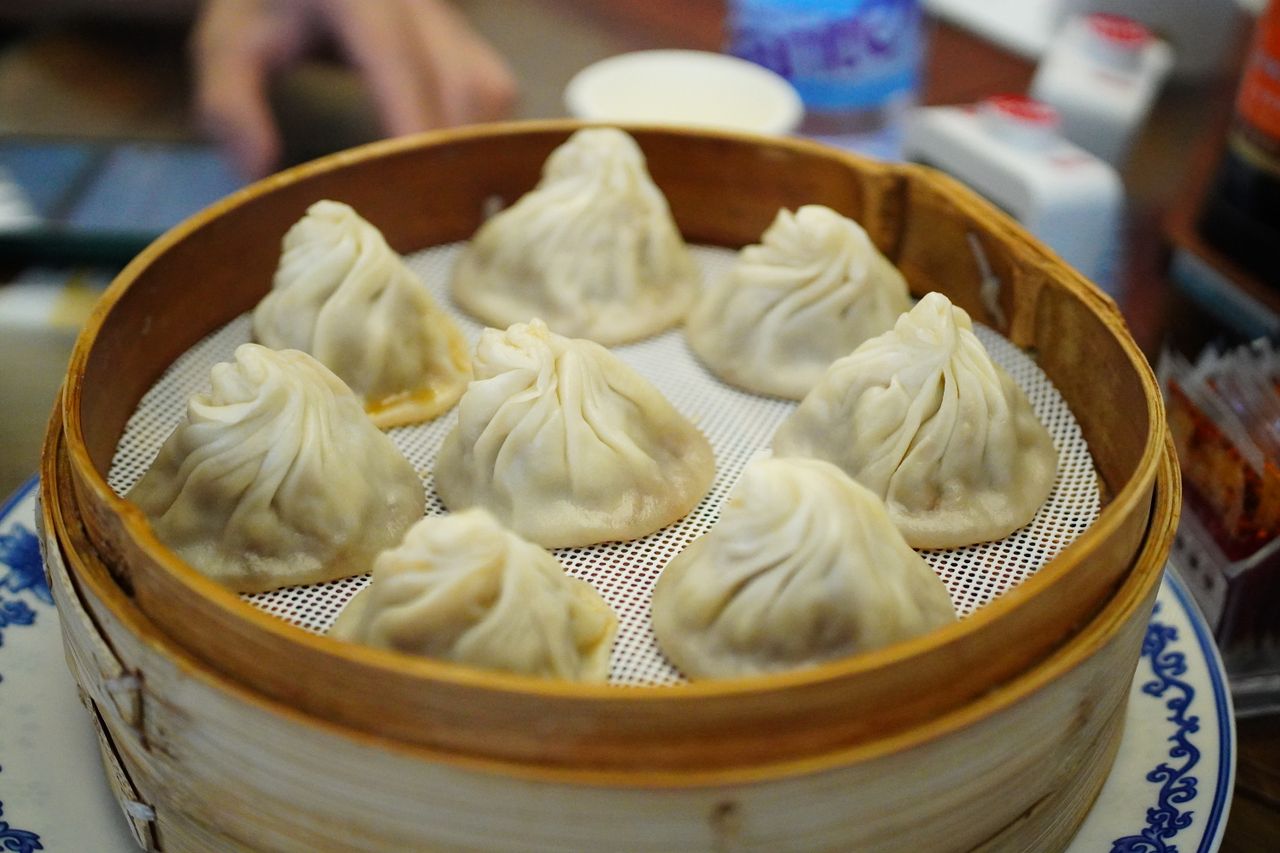 Steamed Chinese soup dumplings in a bamboo basket