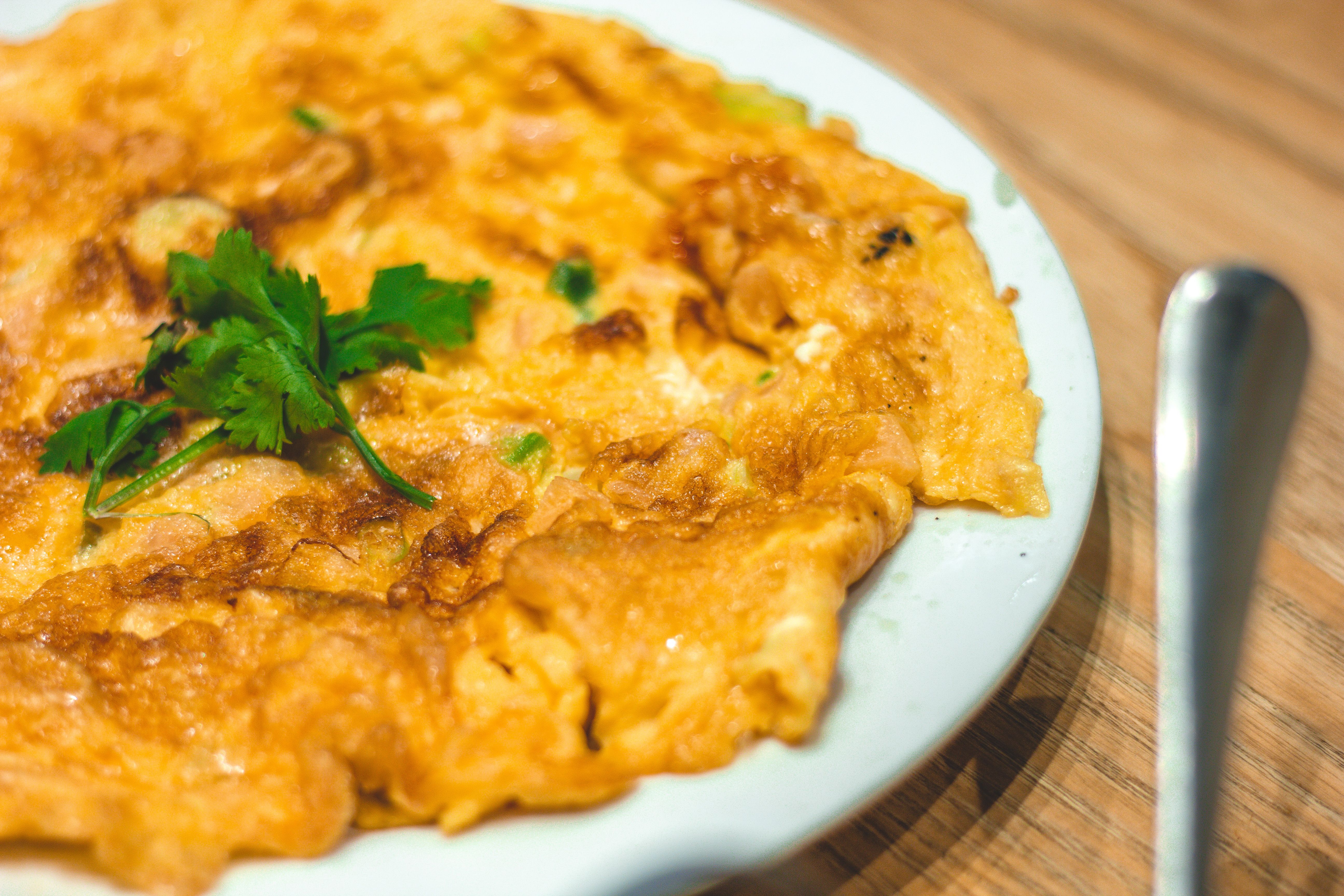A sizzling oyster omelette on a plate