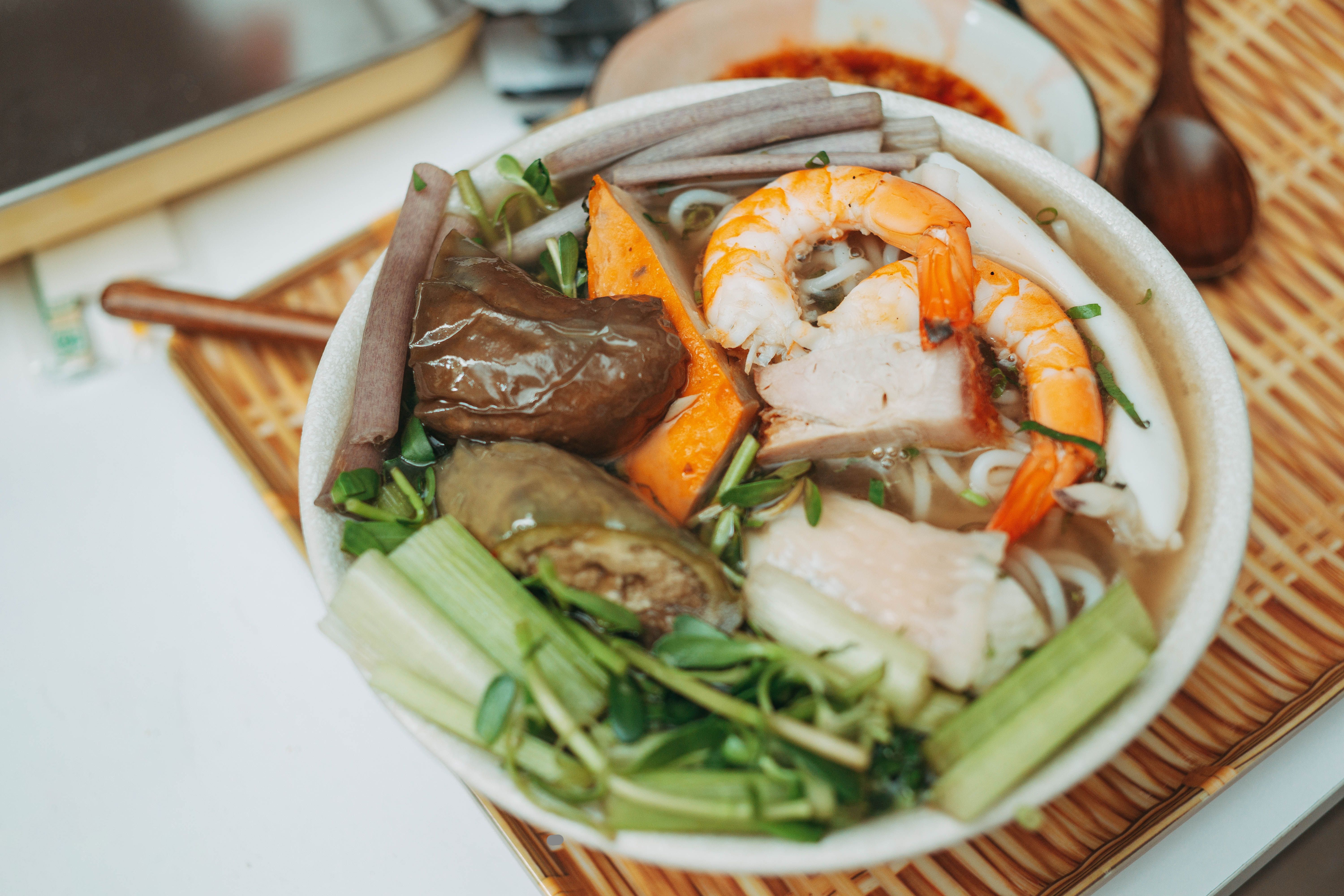 A bowl of shacha noodles with toppings