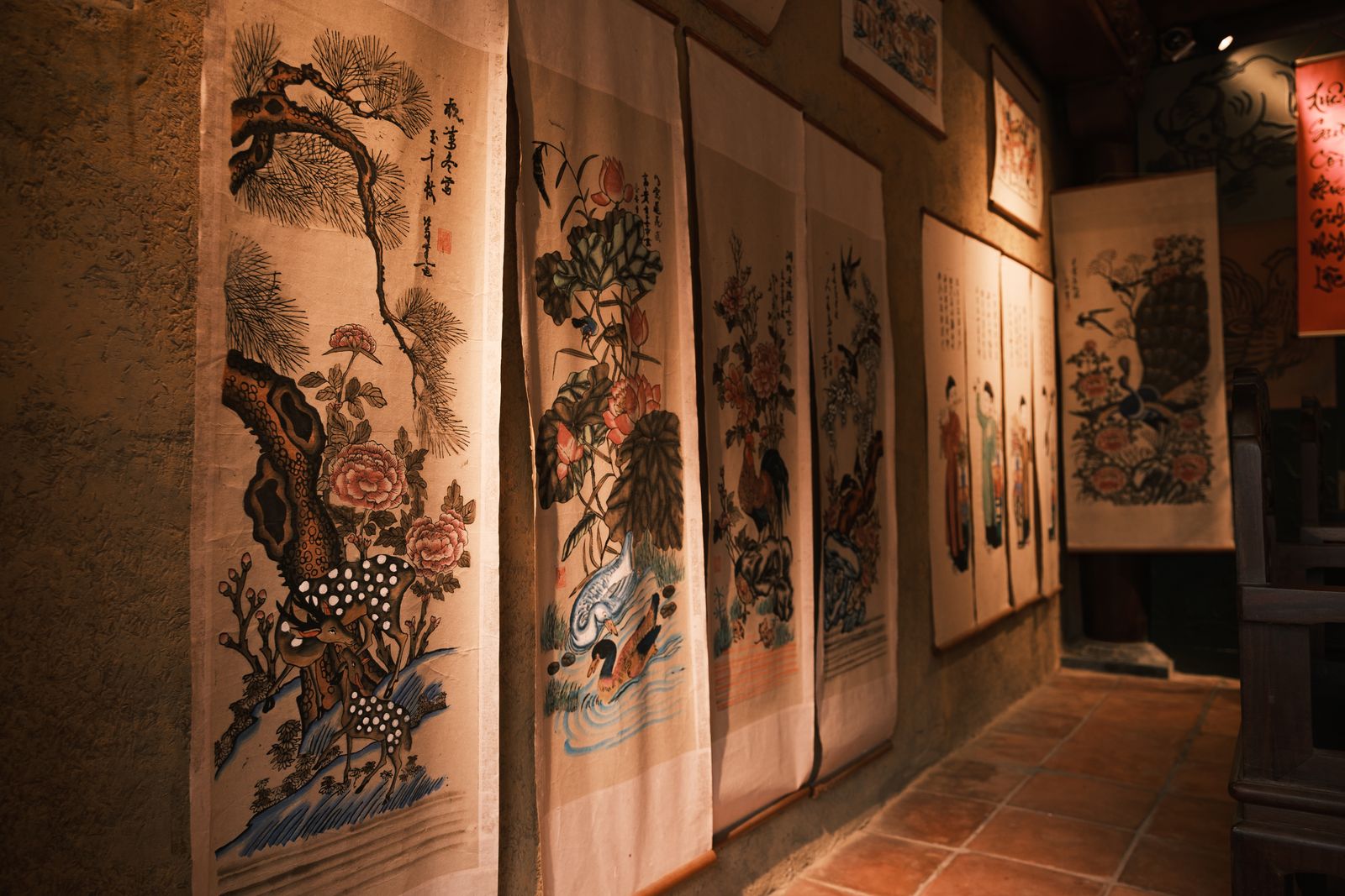 A traditional Chinese landscape scroll painting on display
