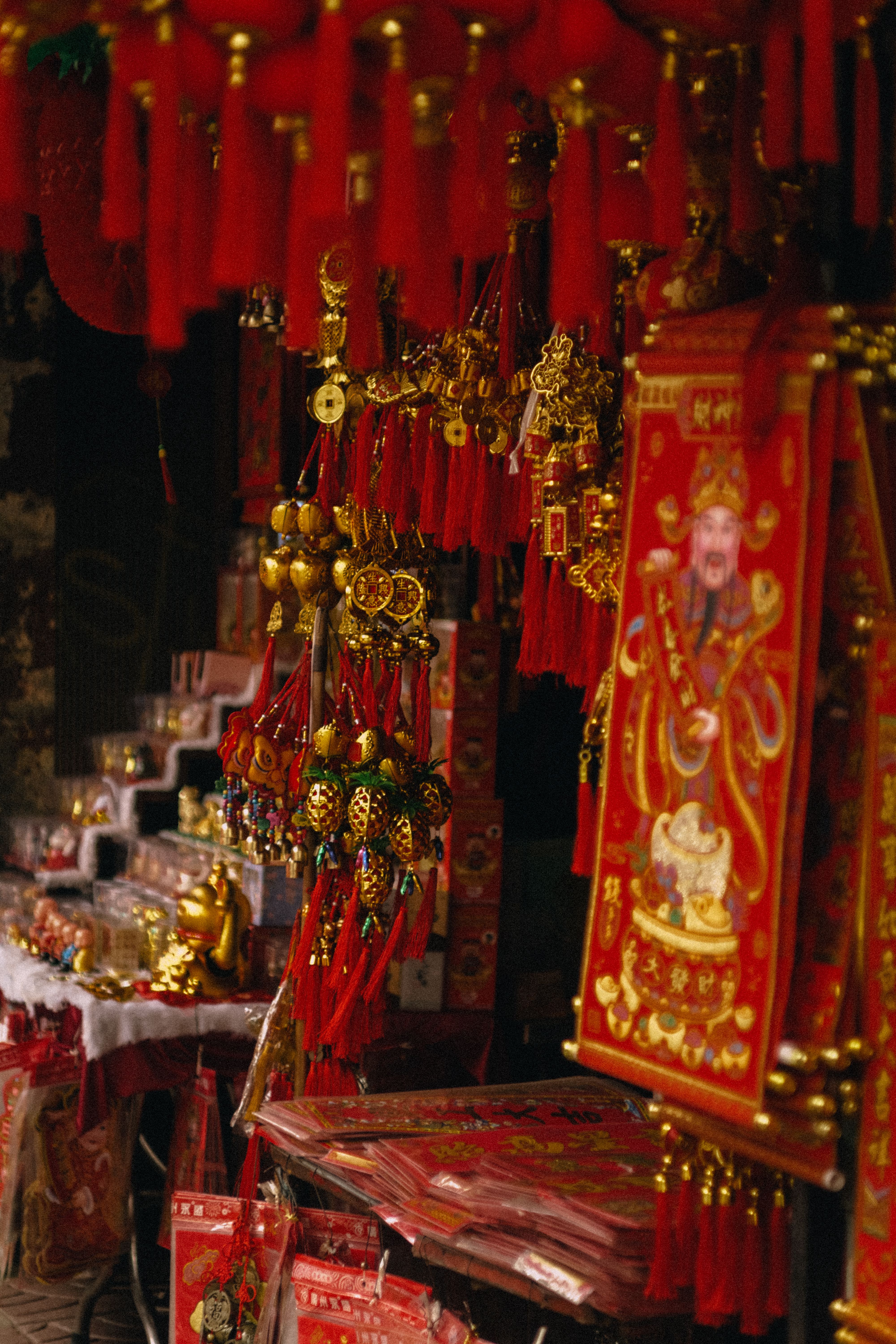 Assorted gold and red Chinese lucky charms on display