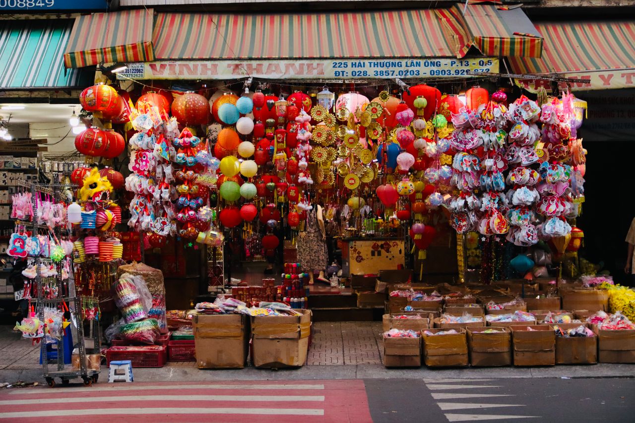 A street with many colourful Chinese lanterns